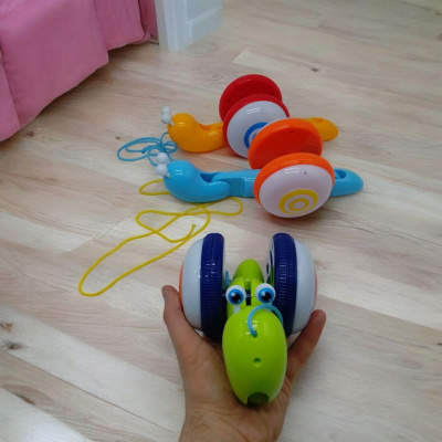 Каталка музична Веселий равлик, помаранчева MIC Q13